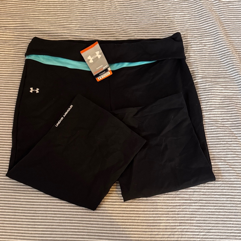 Under Armour women’s Black Crops with Aqua Detail. All season gear